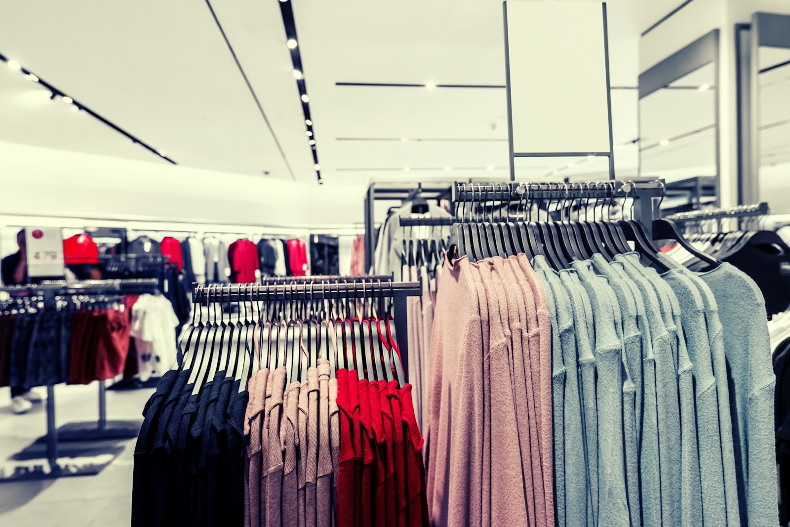 Clothing displayed on racks inside a retail store
